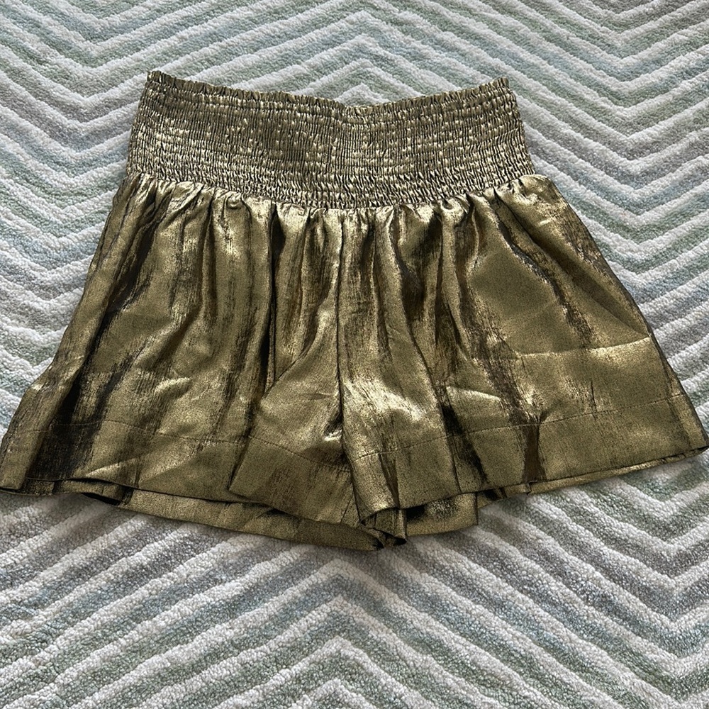 Gold s shorts/skirt, size small, never worn before, liner on inside,